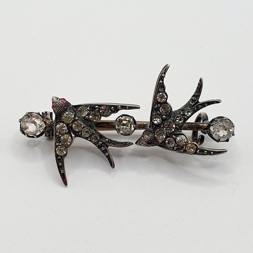 899 - A late 19th/early 20th century paste set brooch, in the form of two swallows