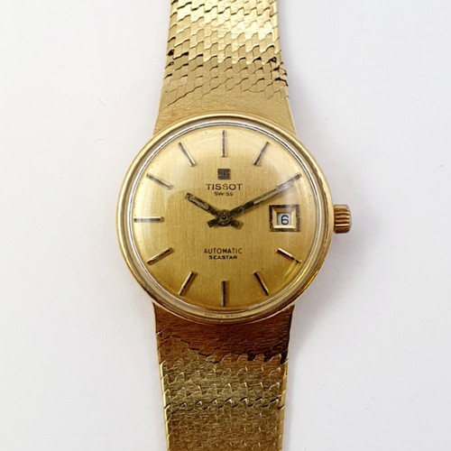 1044 - A ladies 18ct gold Tissot wristwatch, all in 51 g