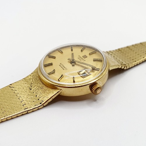 1044 - A ladies 18ct gold Tissot wristwatch, all in 51 g