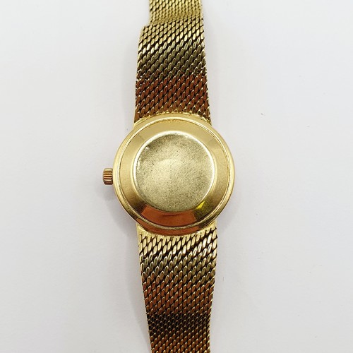 1044 - A ladies 18ct gold Tissot wristwatch, all in 51 g