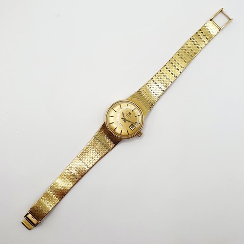 1044 - A ladies 18ct gold Tissot wristwatch, all in 51 g