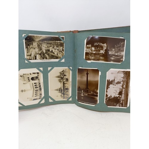 302 - An album of postcards, a silver plated coffee pot, a matching teapot, a 1951 Exhibition catalogue, a... 