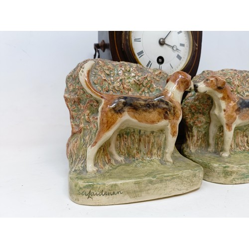 342 - An Edwardian inlaid mahogany mantel clock, a pair of dog bookends, damaged, a wall light and other i... 