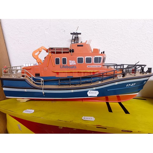 413 - A model of a Lifeboat, 46 cm wide, a boat model kit, two other model boats, and part of a model boat... 