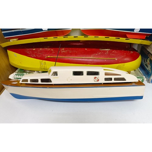 413 - A model of a Lifeboat, 46 cm wide, a boat model kit, two other model boats, and part of a model boat... 