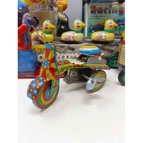 433 - A clockwork tinplate psychedelic scooter, a Chinese tinplate Racing Car, assorted other tinplate and... 