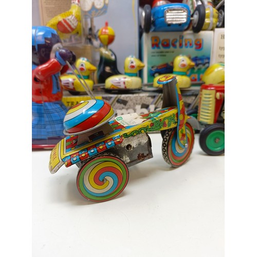 433 - A clockwork tinplate psychedelic scooter, a Chinese tinplate Racing Car, assorted other tinplate and... 