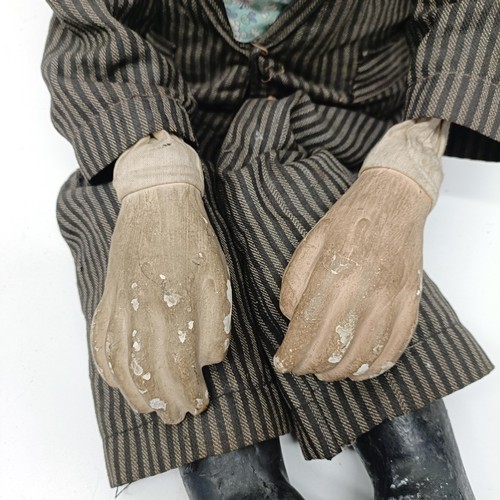 454 - A male ventriloquist dummy, with glass eyes and moving mouth, 88 cm high