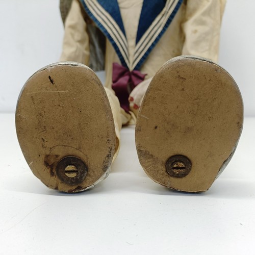 455 - A male sailor ventriloquist dummy, with glass eyes and moving mouth, 86 cm high