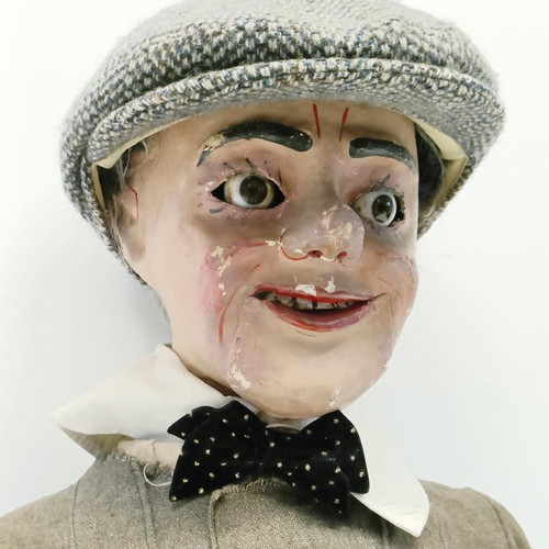 458 - An early 20th century male ventriloquist dummy, with glass eyes and moving mouth, 94 cm high