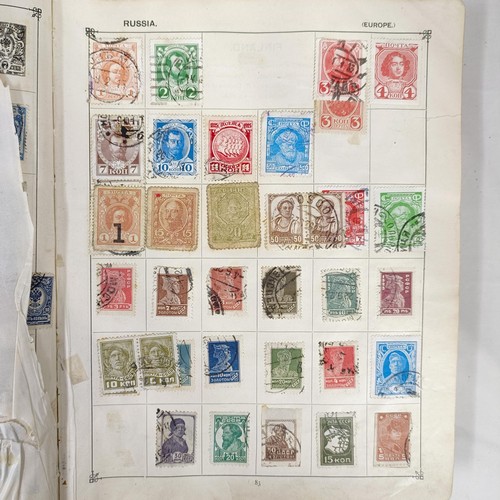 31 - A Strand Postage Stamp album, of assorted world stamps, binding poor/loose