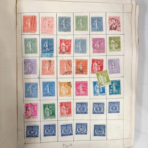 31 - A Strand Postage Stamp album, of assorted world stamps, binding poor/loose