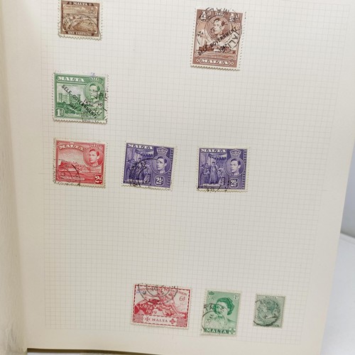 32 - An album of world stamps, with a box cover/slip case