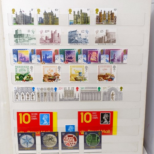 61 - A collection of GB stamps, including a few QVR, but mostly modern commemoratives/presentation packs,... 