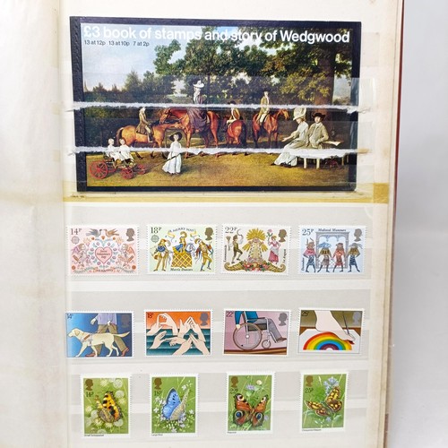 61 - A collection of GB stamps, including a few QVR, but mostly modern commemoratives/presentation packs,... 