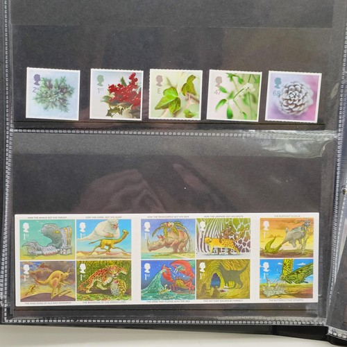 61 - A collection of GB stamps, including a few QVR, but mostly modern commemoratives/presentation packs,... 