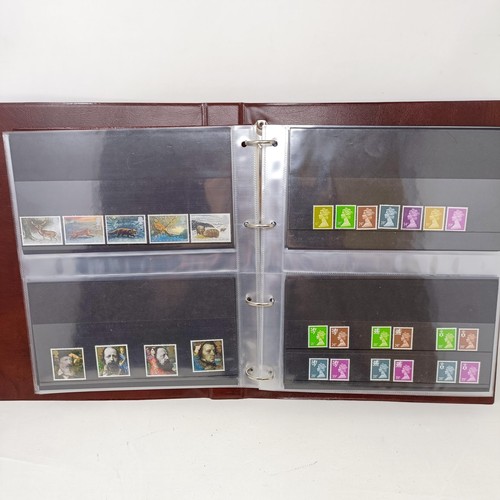 61 - A collection of GB stamps, including a few QVR, but mostly modern commemoratives/presentation packs,... 