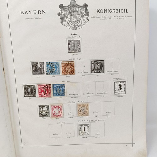 1 - A Schaubek postage stamp album, with assorted world stamps, including a GB Penny Black, 1894 edition