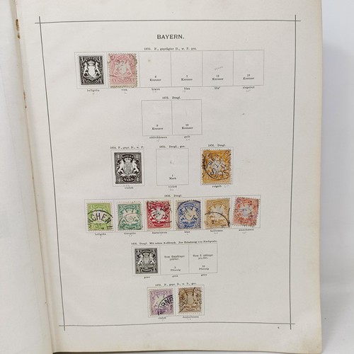 1 - A Schaubek postage stamp album, with assorted world stamps, including a GB Penny Black, 1894 edition