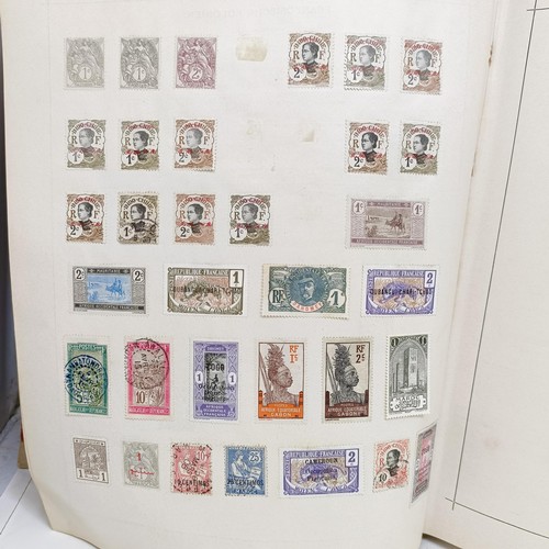 1 - A Schaubek postage stamp album, with assorted world stamps, including a GB Penny Black, 1894 edition