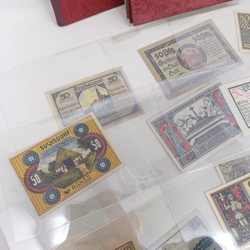 228 - A group of nine German pay books, another booklet, a group of German Third Reich coins, and assorted... 