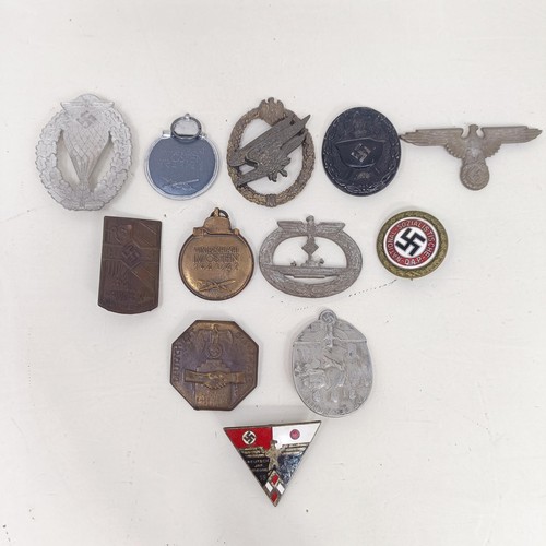 229 - A group of assorted German items, including a WWII 1939 German and Japanese Alliance buttonhole badg... 