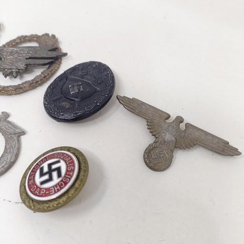 229 - A group of assorted German items, including a WWII 1939 German and Japanese Alliance buttonhole badg... 