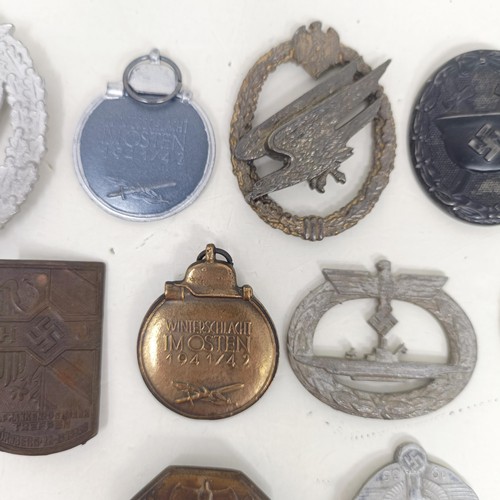 229 - A group of assorted German items, including a WWII 1939 German and Japanese Alliance buttonhole badg... 