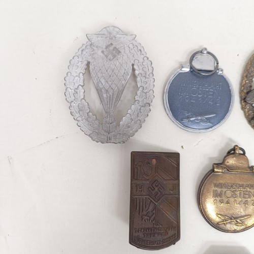 229 - A group of assorted German items, including a WWII 1939 German and Japanese Alliance buttonhole badg... 