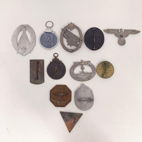 229 - A group of assorted German items, including a WWII 1939 German and Japanese Alliance buttonhole badg... 