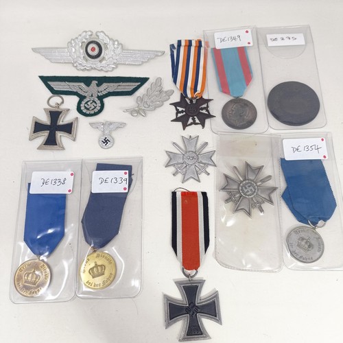 230 - A group of assorted German items, including medals and other items