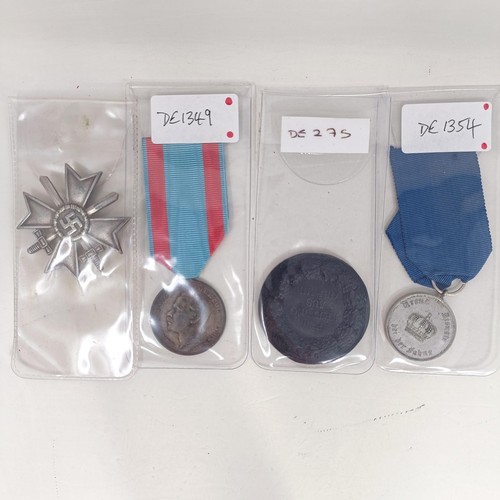 230 - A group of assorted German items, including medals and other items