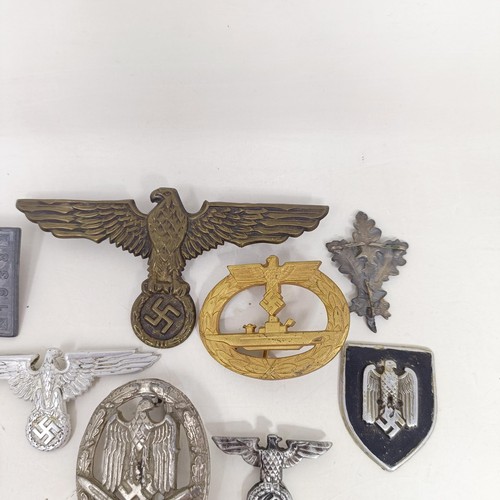 231 - A group of assorted German items, including a Kriegsmarine U Boat badge