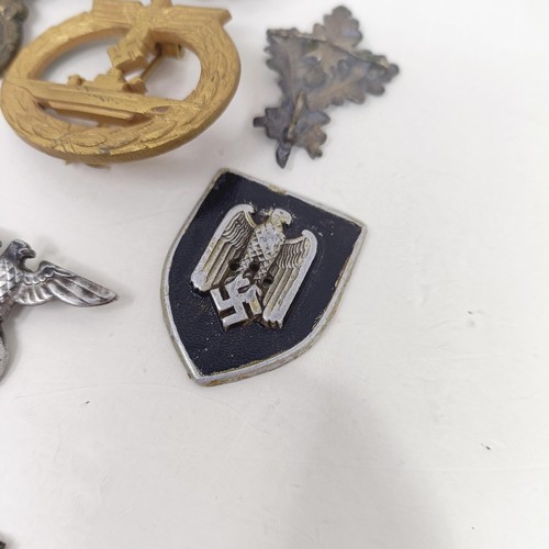 231 - A group of assorted German items, including a Kriegsmarine U Boat badge