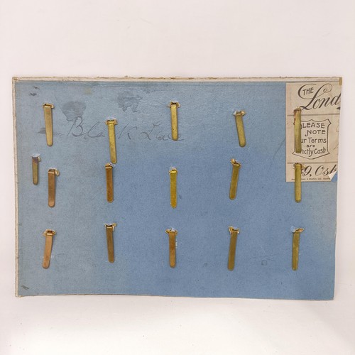 151 - A group of assorted military badges, mounted on three cards