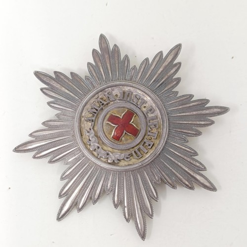 154 - A Russian Order of St Anne breast star, in silver and red enamel, the bar stamped Kiebel, lacks enam... 