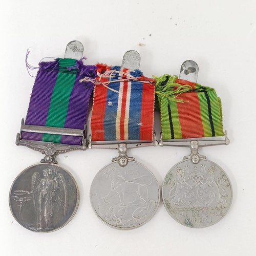 252 - A group of three medals, comprising a War Medal, Defence Medal and a General Service Medal 1918-62, ... 