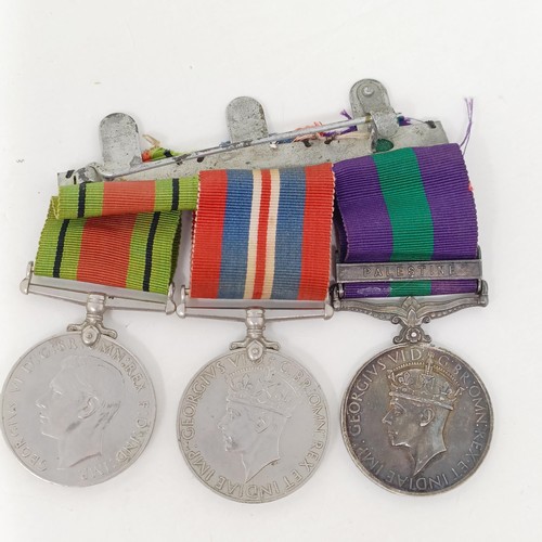 252 - A group of three medals, comprising a War Medal, Defence Medal and a General Service Medal 1918-62, ... 