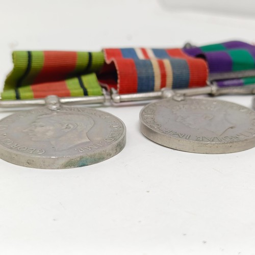 252 - A group of three medals, comprising a War Medal, Defence Medal and a General Service Medal 1918-62, ... 