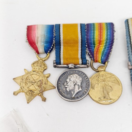 241 - A group of assorted miniature medals and other items