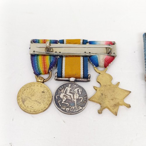 241 - A group of assorted miniature medals and other items