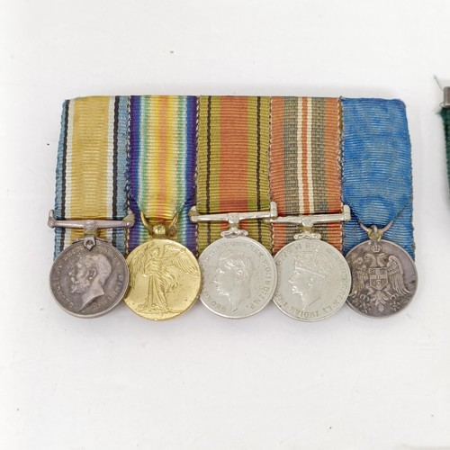 241 - A group of assorted miniature medals and other items