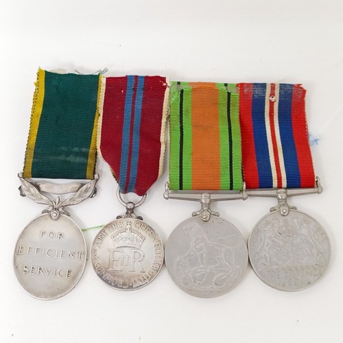 243 - A group of four medals, comprising a Defence Medal, a War Medal, a Queen Elizabeth II Coronation Med... 