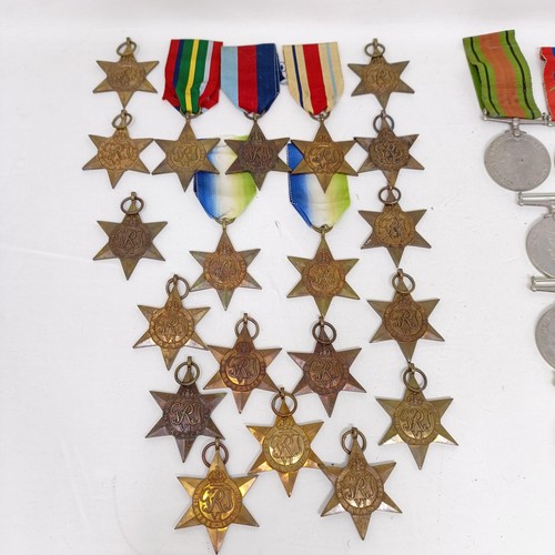 244 - A large group of assorted WWII Medals and Stars