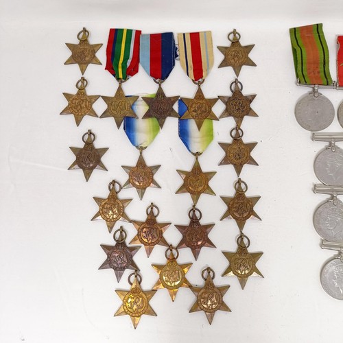 244 - A large group of assorted WWII Medals and Stars