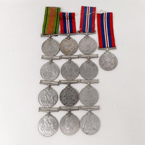 244 - A large group of assorted WWII Medals and Stars