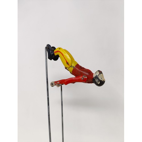 443 - A tinplate acrobatic monkey