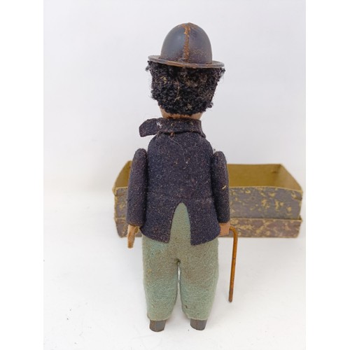 444 - An early 20th century tinplate clockwork Charlie Chaplin toy, boxed