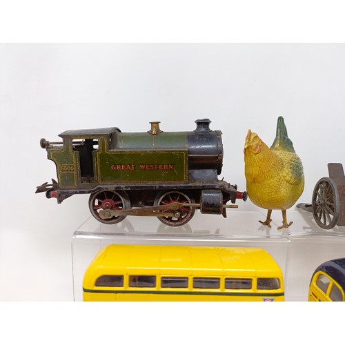 400 - A clockwork 0-4-0 locomotive, 6600, a set of Bassett-Lowke buffers, and a group of model vehicles (b... 