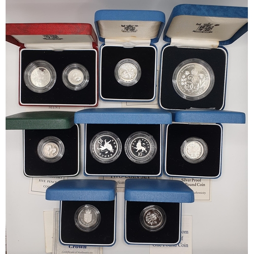 94 - A Royal Mint silver proof £1 coin, 1991, boxed, and others similar